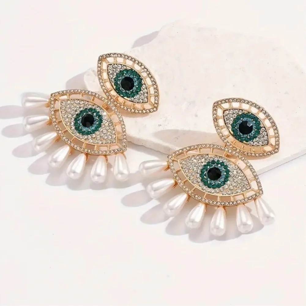 Elegant Gold and Pearl Eye Earrings